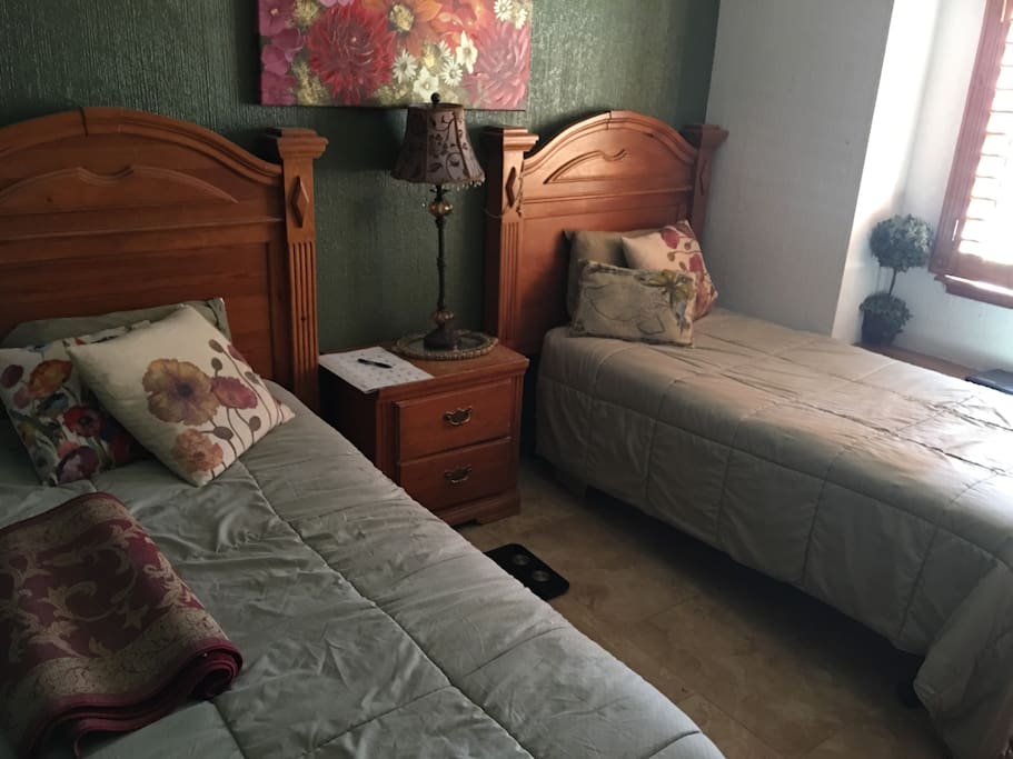 2 beds and a lamp
