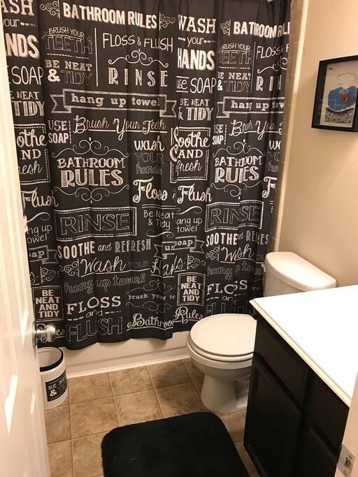 A full private bathroom right next to the room downstairs