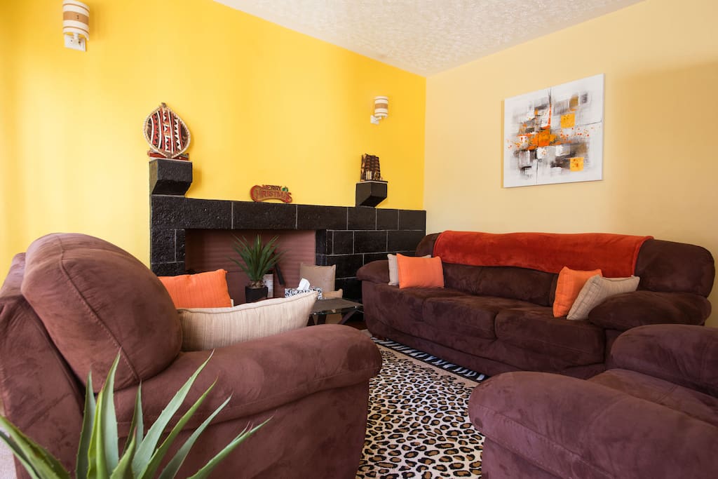 Lounge with fireplace and overlooking garden.