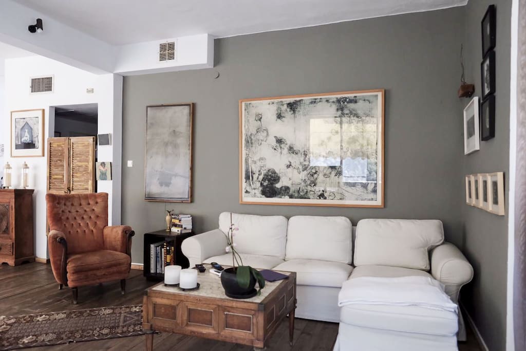 A living room surrounded by a round terrace overlooking Rothschild Blvd.