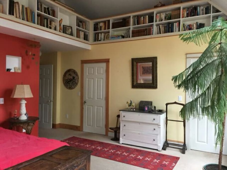 Sunny master bedroom with vaulted ceilings.