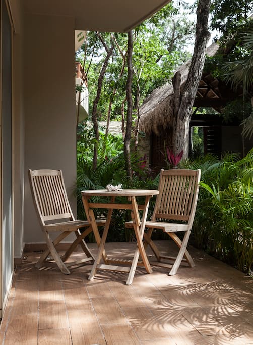 The apartment front patio from the floor-to-ceiling sliding doors