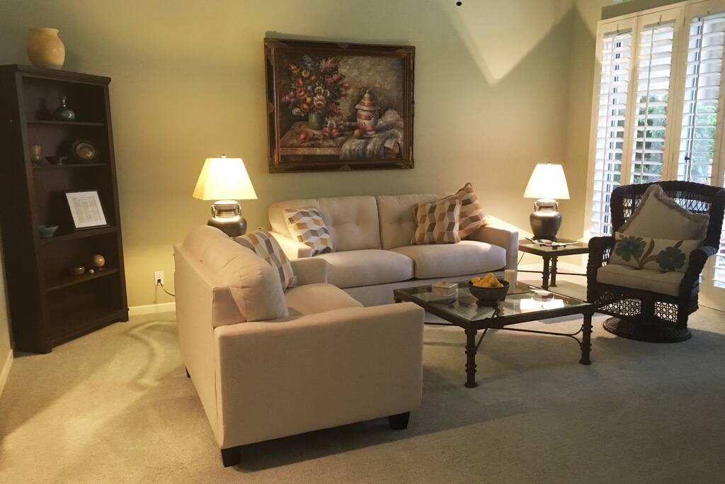Living room with access to patio overlooking the fairway