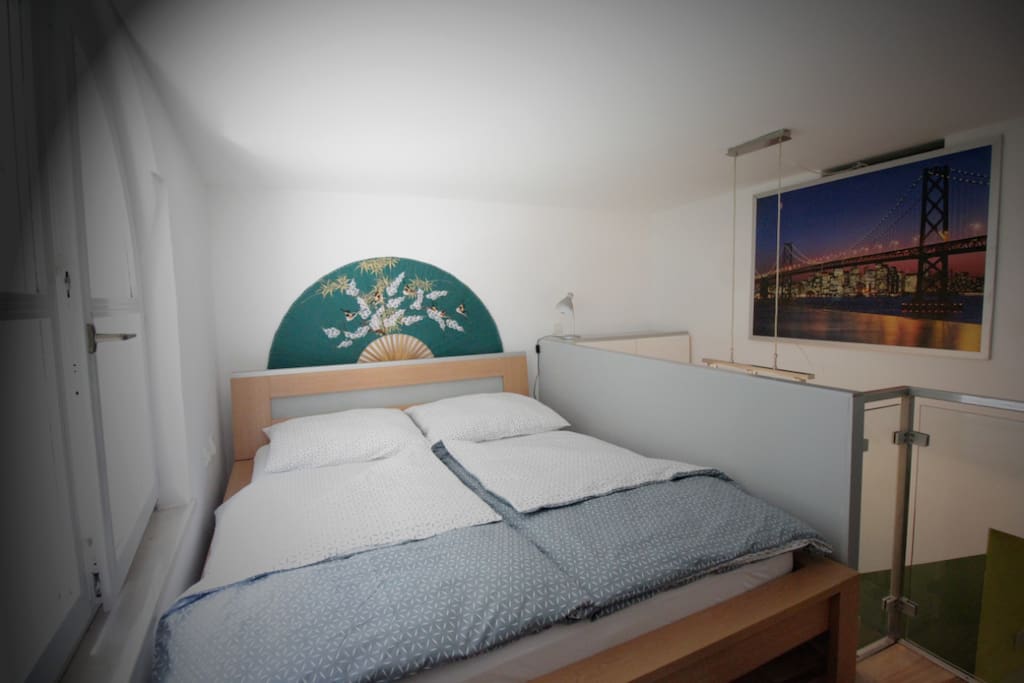 Romantic bedroom in the loft. Lots of natural light and fresh air.