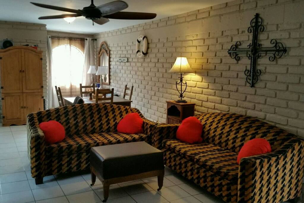 Good size living room with two pull-out beds and ceiling fans in every room.