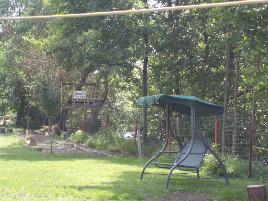 backyard with swing and tree house