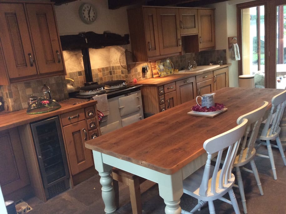 Warm and cosy farm house kitchen with Aga, the hub of the home.