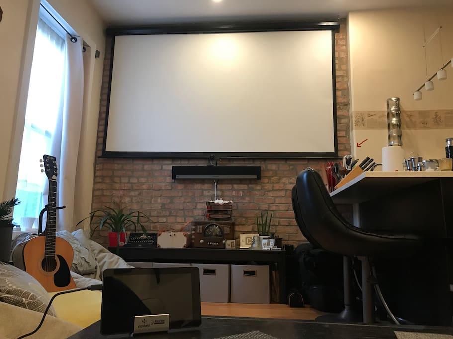 Huuuge projector screen with Apple TV, Amazon Fire TV and even an Xbox. SONOS system throughout apartment.