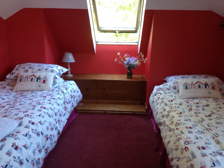 Twin beds, with window looking onto park
