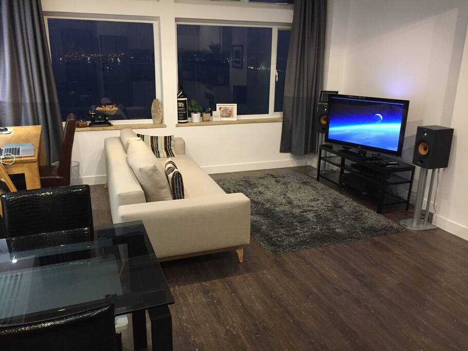 Living area with Sofa bed, TV, Hi-Fi music system and Apple TV. HUE lighting controlled by the app.