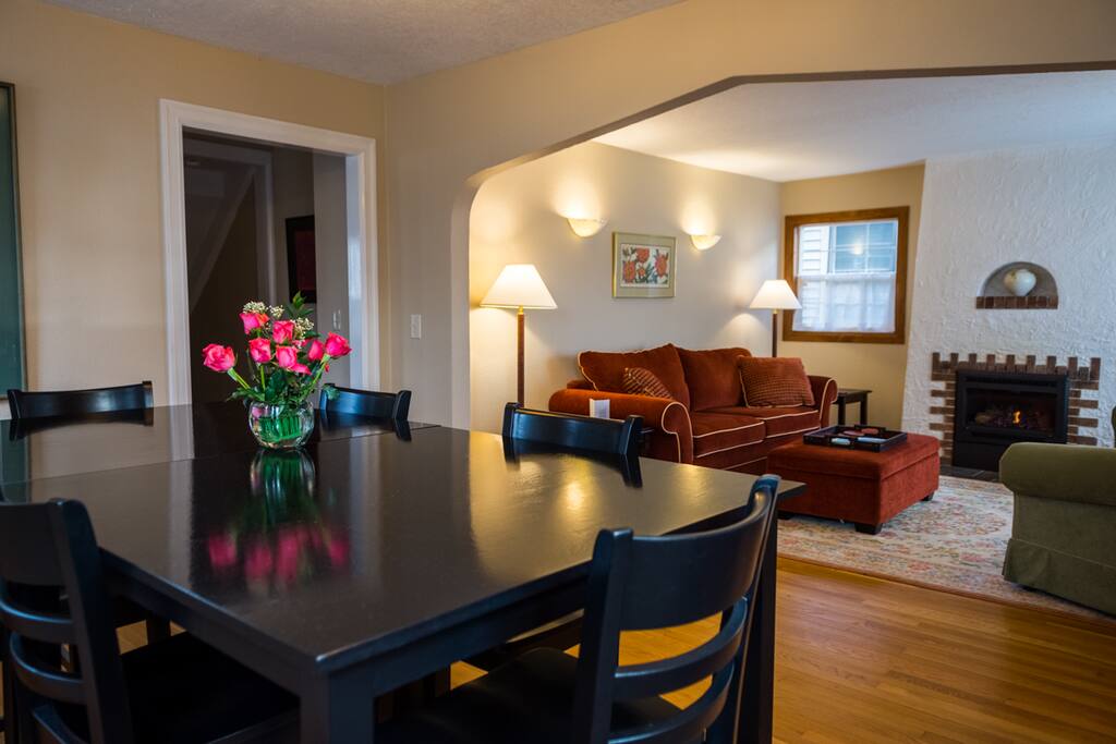 Looking from the dining room toward the living room and fireplace. Kitchen is on the left