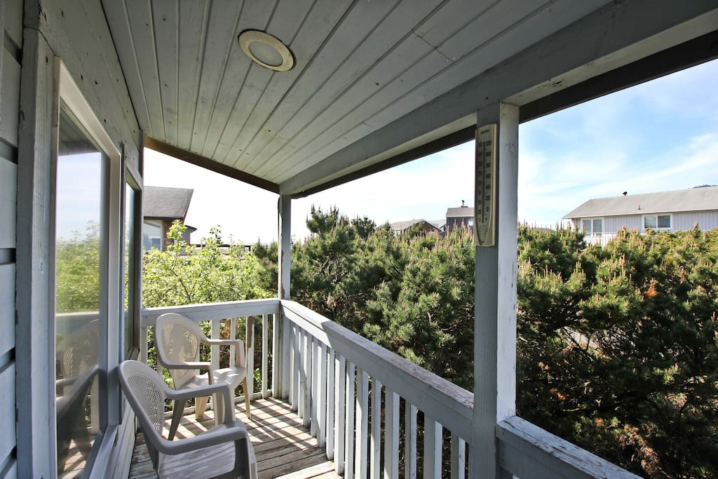 Upper level deck with patio chairs.
