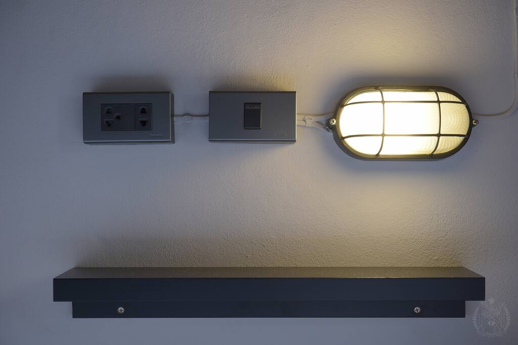 Personal in-bed shelf and reading light.