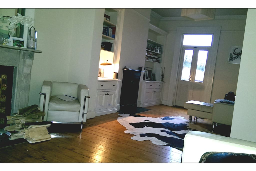 Large open sitting room with simple furnishings. Real fireplaces.