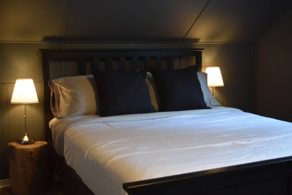 new queen bed with luxurious new linens
