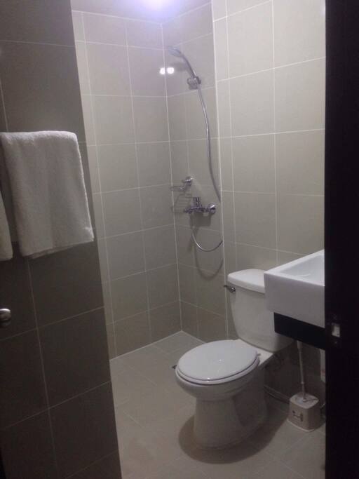 Common bathroom complete with hot water and bidet