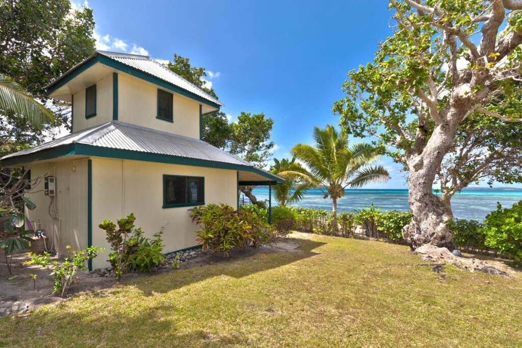 Beach Front Green House at Lucky's Beach Cottages for Rent in Talihau