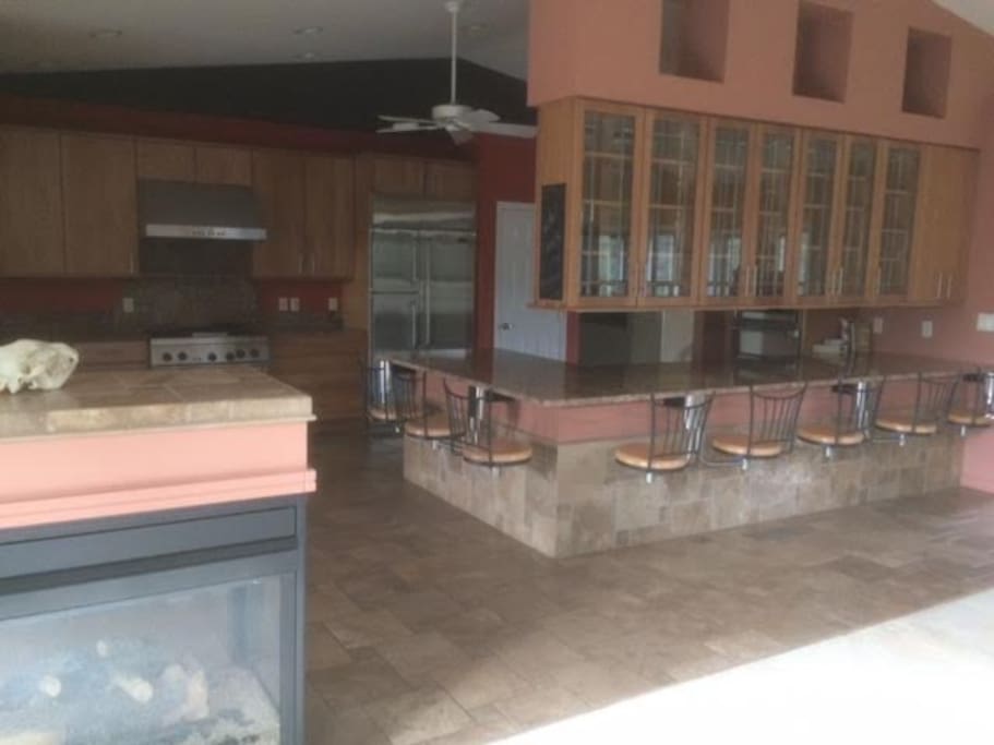 Gourmet kitchen, triple oven, granite, seating for eight.