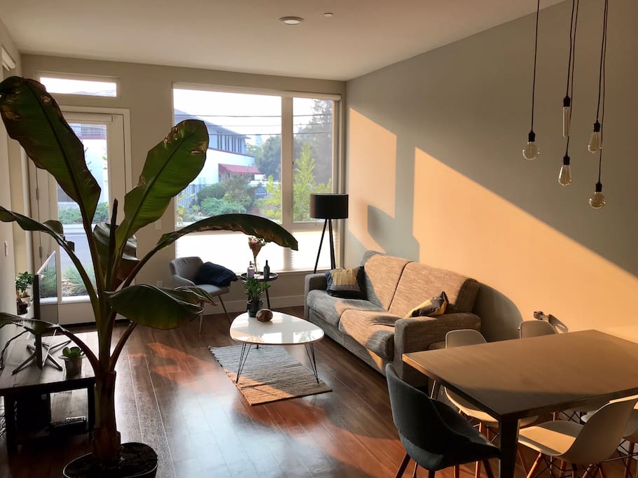 Living area with big flat screen TV and additional arm chair