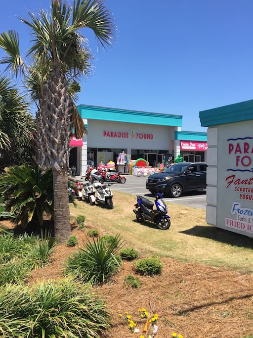 Shop next door with moped rentals and souvenirs