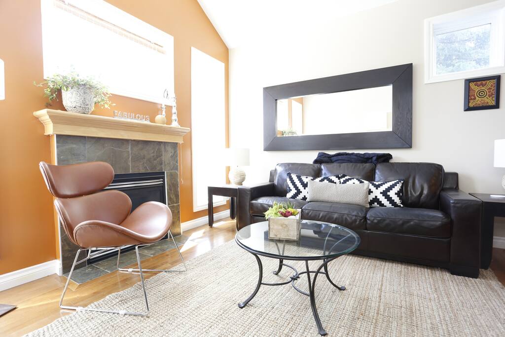Living Room w fireplace overlooks backyard garden