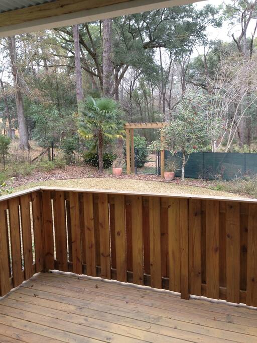 Private back deck with a view of the park