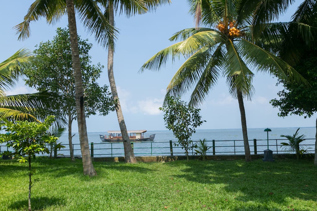 View of the House Boat passing through the Vembanadu Lake from the property.