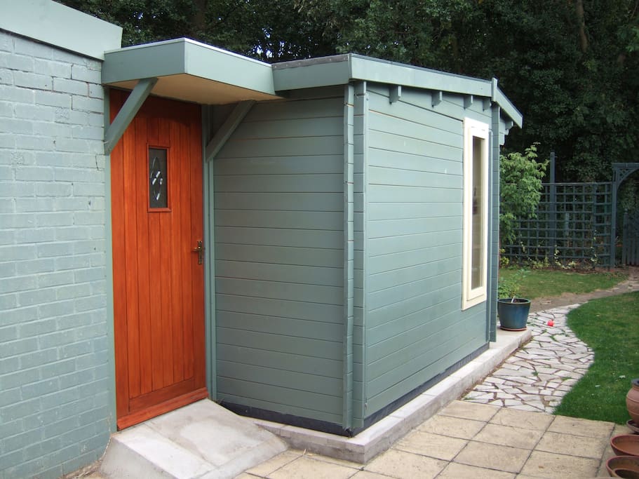 Your own front door with ramp for wheels. Outside porch light and door bell.
