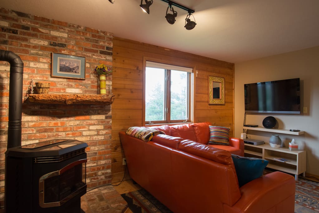 The cozy living room is a great place to unwind after a long day of hiking and exploring the mountains.