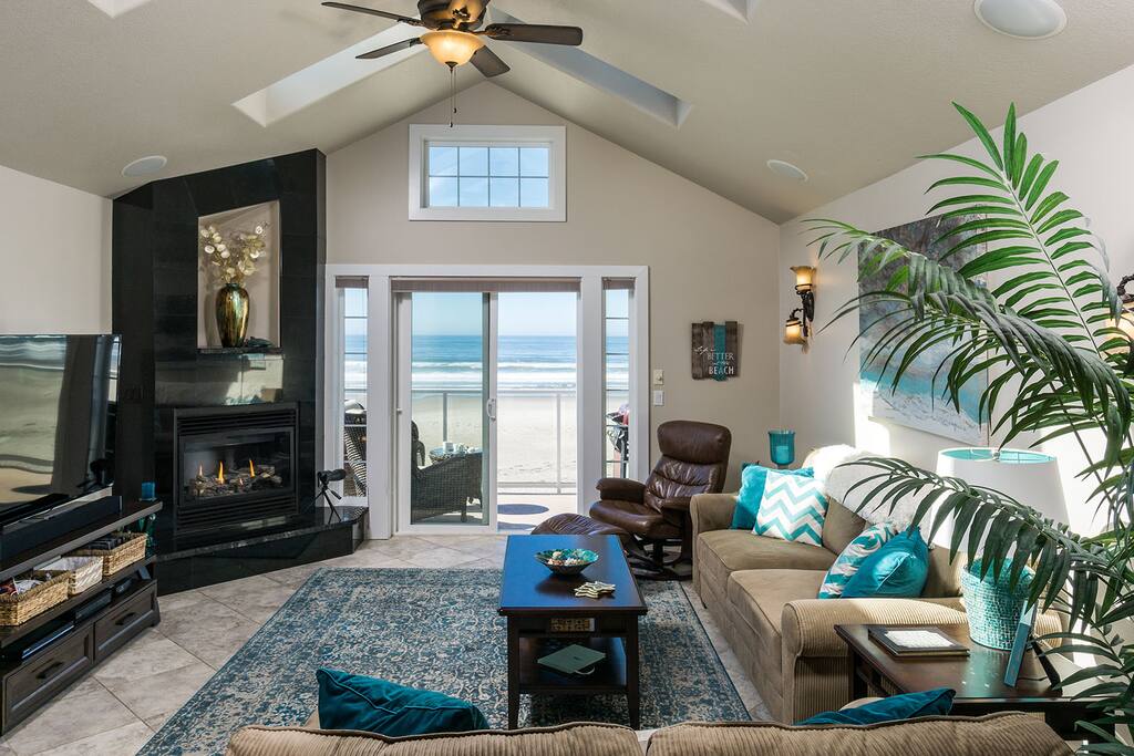 Sunny and spacious third floor living room complete with gas fireplace and cable-equipped TV