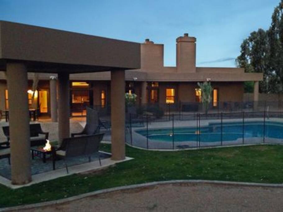 Covered outdoor sitting area with fire pit