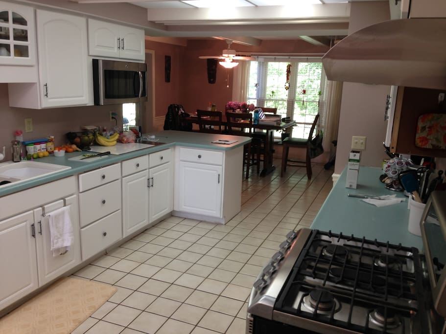 Kitchen with shared fridge and pantry space. Extra full fridge in the garage