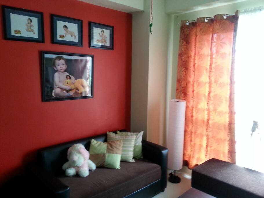 Our quiet, relaxing living room with photos of our adorable son..
