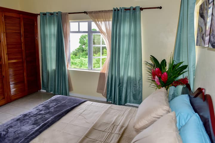 Bedroom with breathtaking view of the ocean.