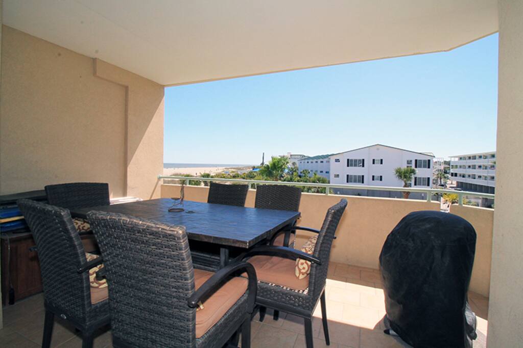 Enjoy a Full Size Swimming Pool, views of the Atlantic Ocean and Beautifully Manicured Courtyard from your Private Balcony with Electric Grill
