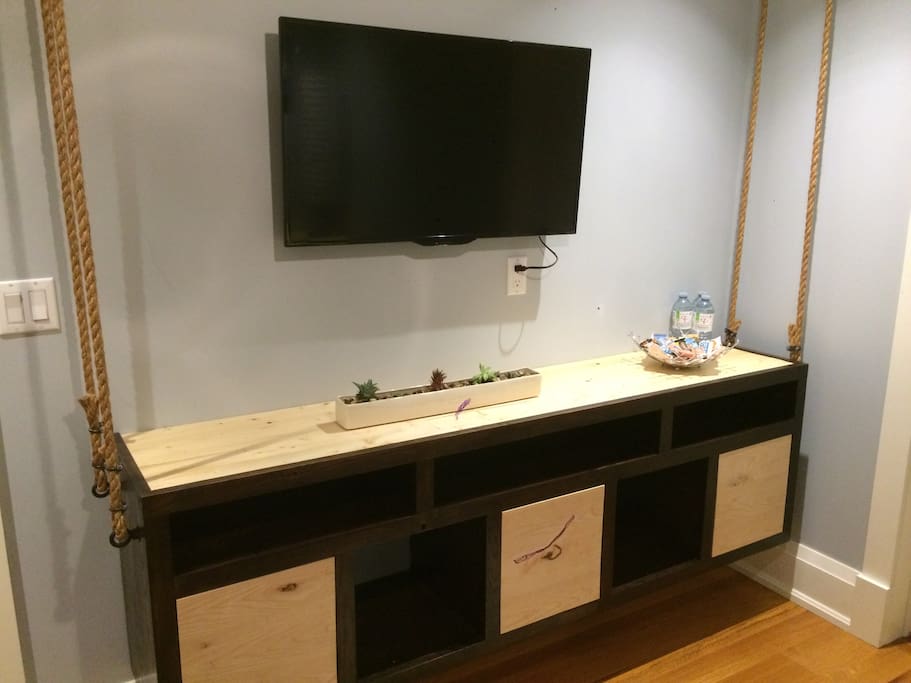Rustic, hand made cabinet. Smart TV for your entertainment.