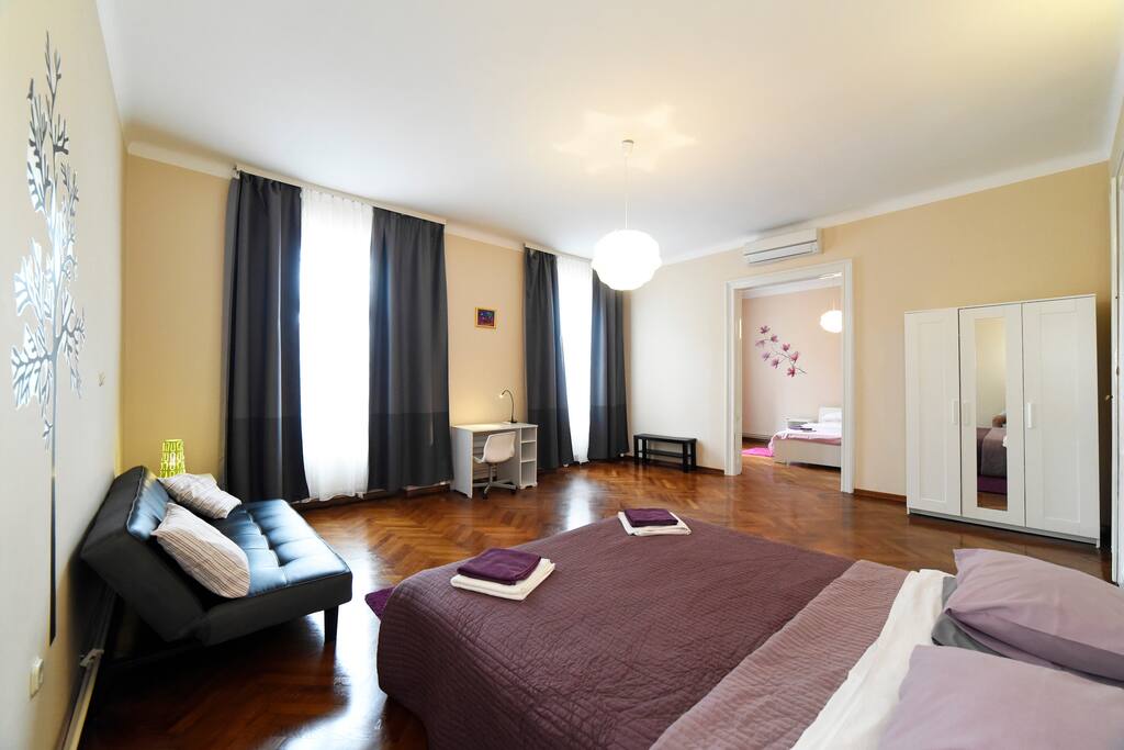 Double bed. Couch. Wardrobe. Desk and chair.