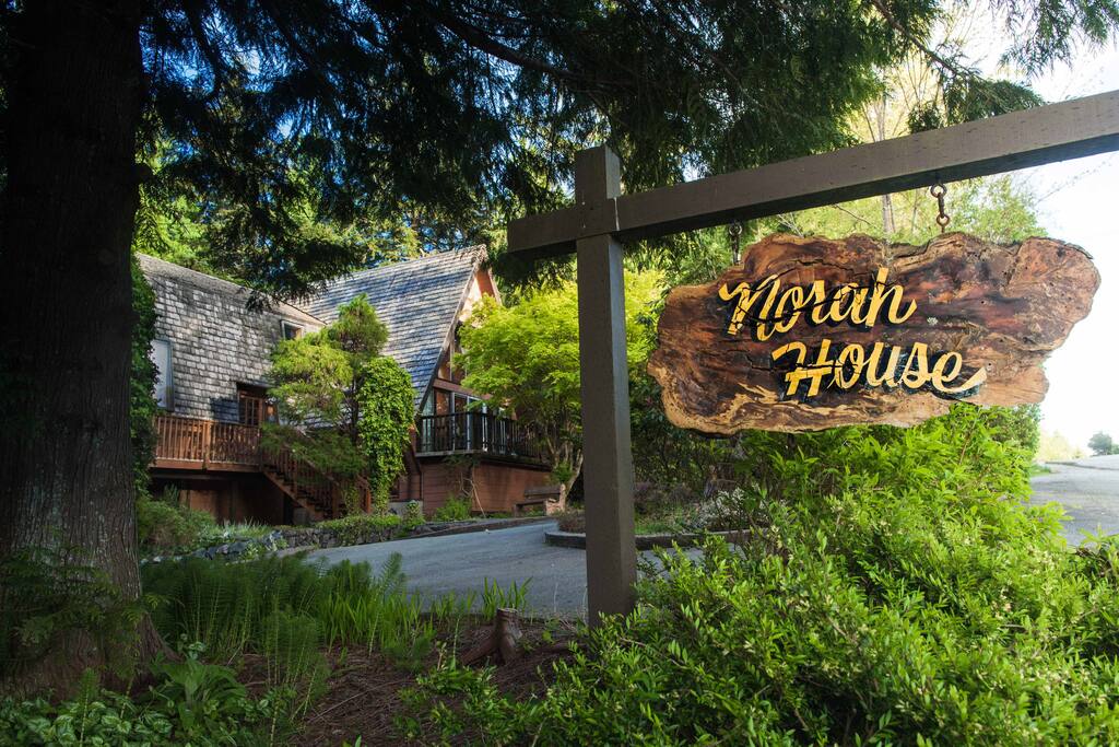 Norah House sign with chalet in the background