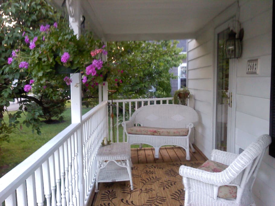 I have added furniture since this picture was taken so the front porch can comfortably accommodate 4 people .