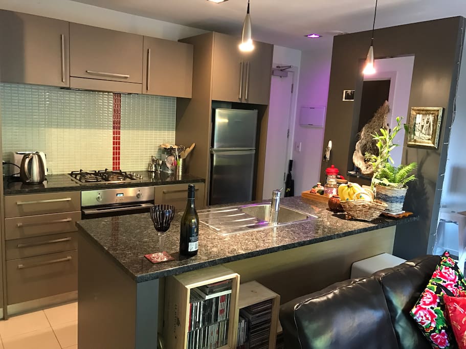 Open-plan kitchen, dining, living.
