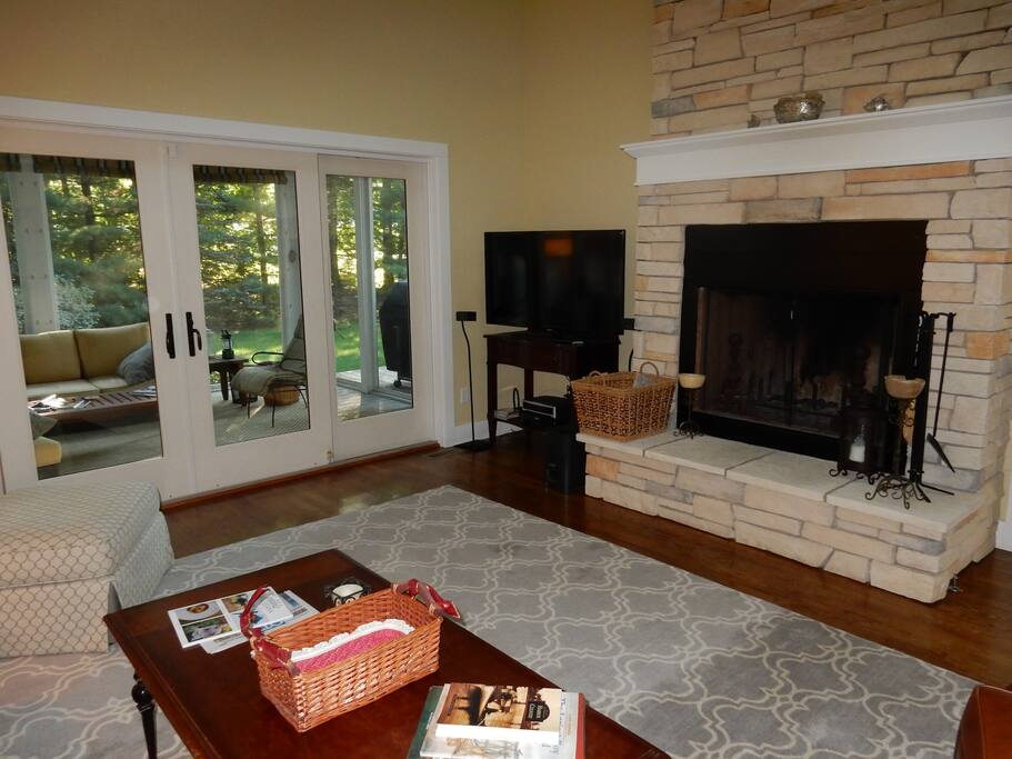 Living room with fireplace (and view of screened porch)