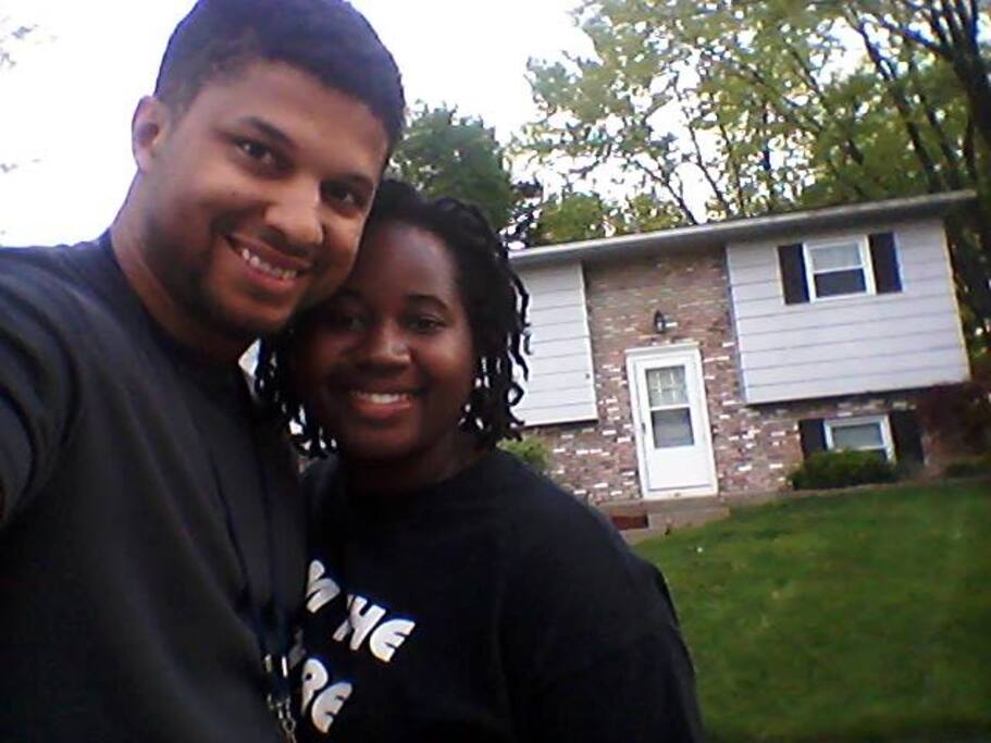 We are standing in front of our lovely home .