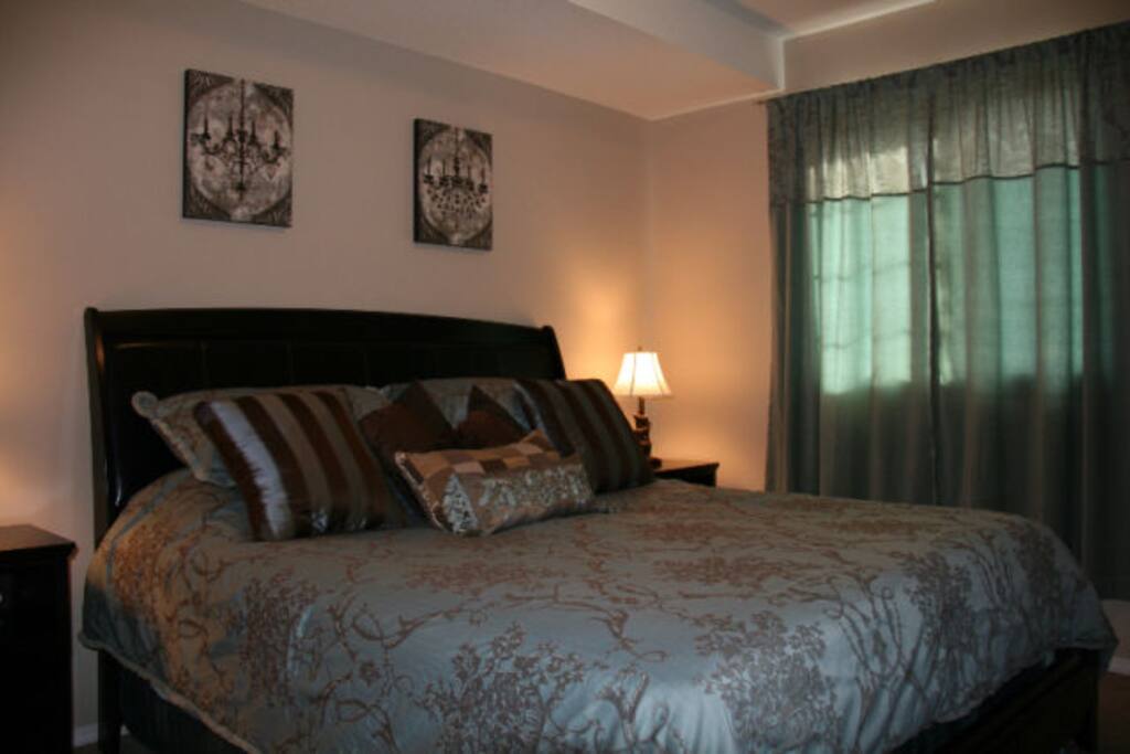 Master bedroom with king size bed and full ensuite including tub