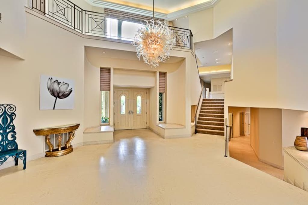 Front Entrance - leading up to the second floor, and down into the great room area.