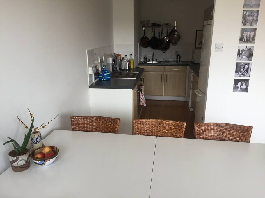 open plan fully equipped kitchen includes dishwasher and microwave.