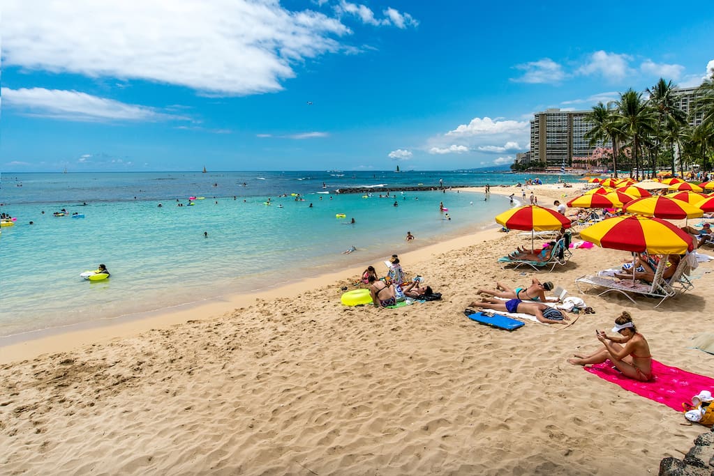 Relax on the sandy beach across from your luxurious suite
