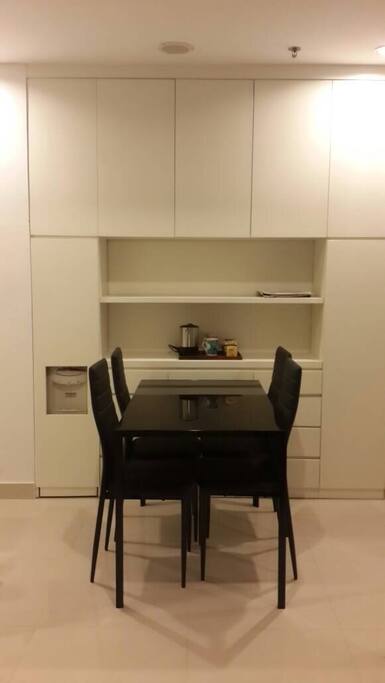 complimentary snacks, drinking water, coffee and tea are provided in the dining area