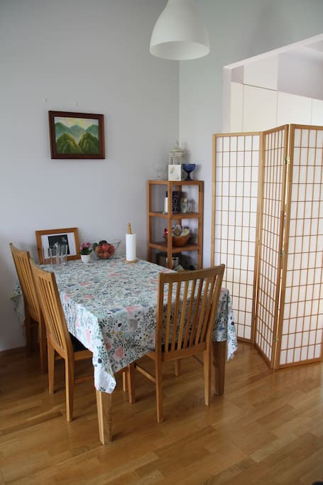 Dining table between kitchen and living room