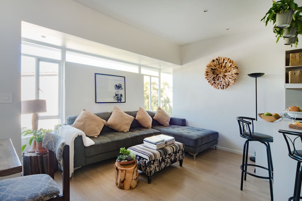 A living room designed with a splash of nature and a touch of sunlight