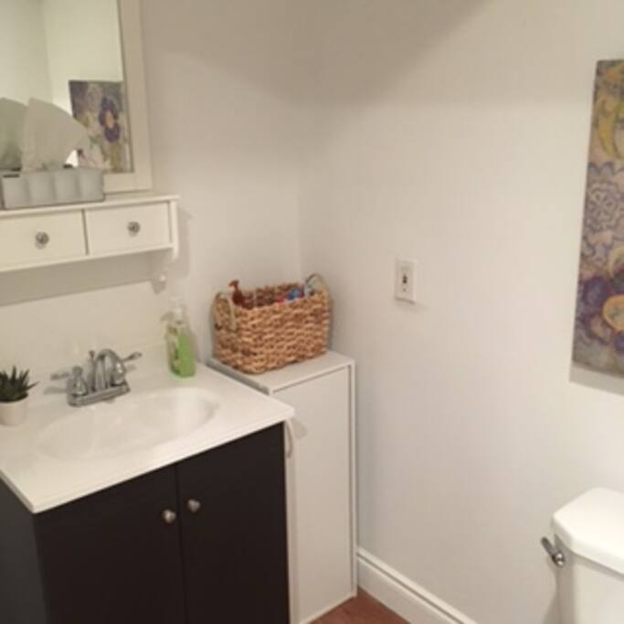 Private bathroom with shower and sink.
